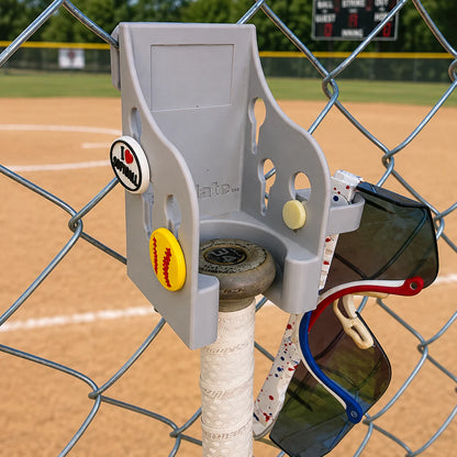 Bat Mate in gray mounted on a fence with Crocs Jibbitz and a Eyeglasses Ring attached.